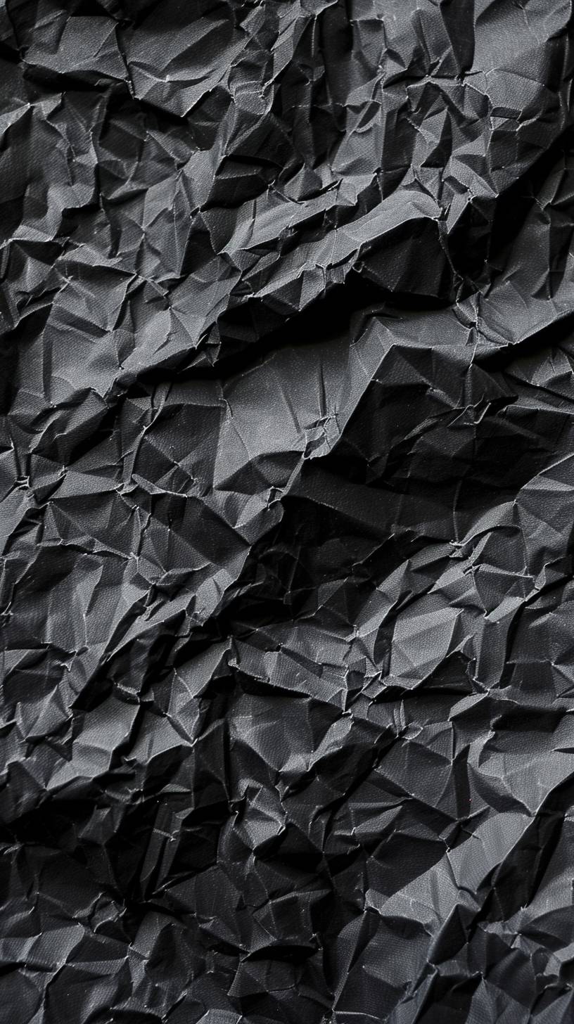 Lightly crumpled black paper background