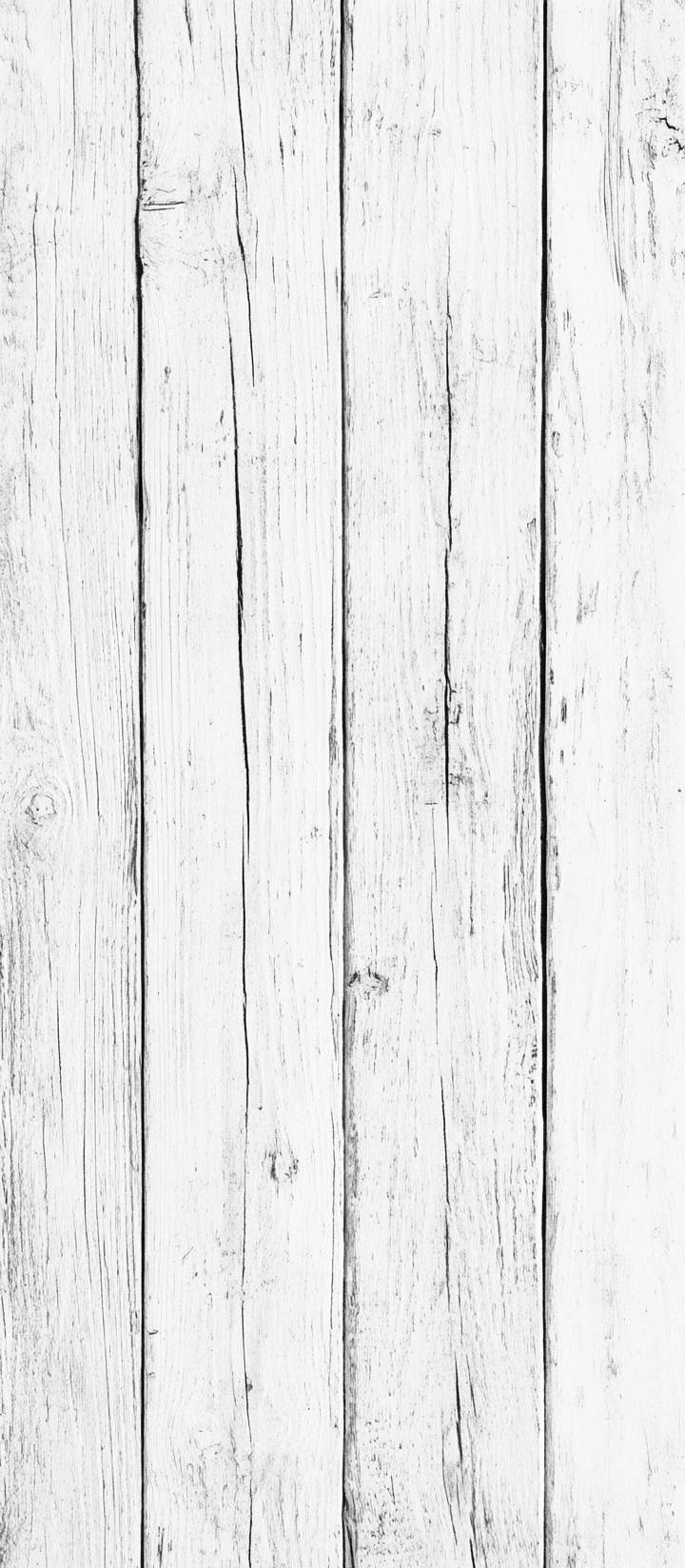 White wood texture background with natural grain pattern of an old wooden table or floor surface.