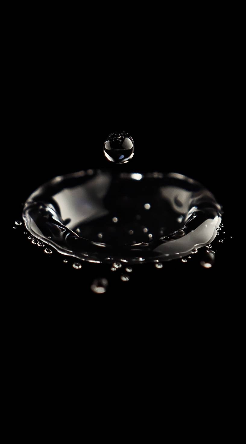 Water drops on a dark background, high-resolution mobile wallpaper.